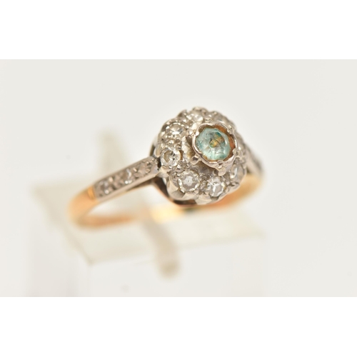 57 - A GEM SET CLUSTER RING, single cut diamonds surrounding a light blue paste stone, set in white metal... 