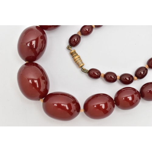 7 - A BAKELITE BEAD NECKLACE, comprising thirty-seven beads, measuring approximately 7.5mm to 22mm, appr... 