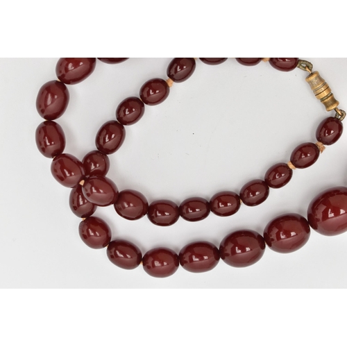 7 - A BAKELITE BEAD NECKLACE, comprising thirty-seven beads, measuring approximately 7.5mm to 22mm, appr... 