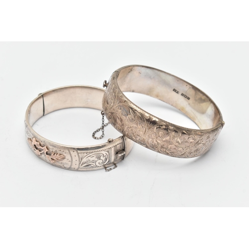 73 - TWO SILVER HINGED BANGLES, the first detailed with yellow metal thistles, fitted with an integrated ... 