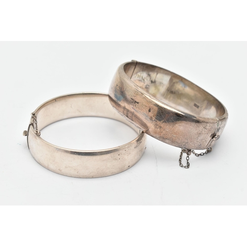 73 - TWO SILVER HINGED BANGLES, the first detailed with yellow metal thistles, fitted with an integrated ... 