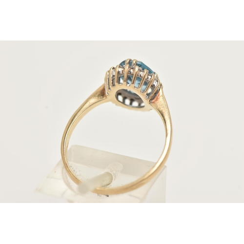 9 - A 9CT GOLD TOPAZ AND DIAMOND RING, designed as an oval blue topaz within a single cut diamond surrou... 