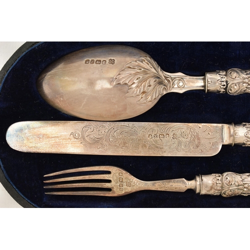 103 - A GEORGE VI CHRISTENING SET, a cased set including a knife, fork and spoon, decorated with scrolling... 