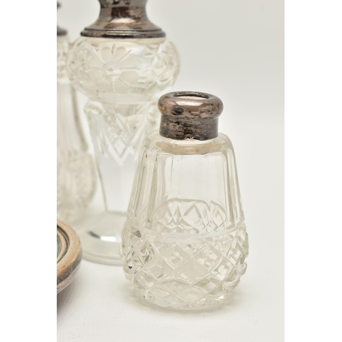 115 - AN ASSORTMENT OF SILVER LIDDED VANITY JARS AN A MIRROR, to include a cut glass scent bottle with a s... 