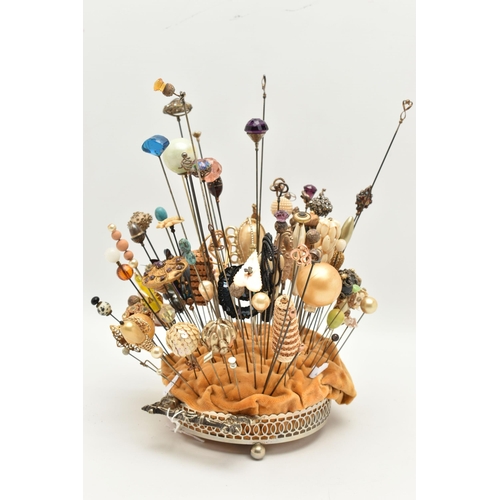 120 - A COLLECTION OF HAT PINS, approximately ninety six hat pins of varying designs, to include eight sil... 