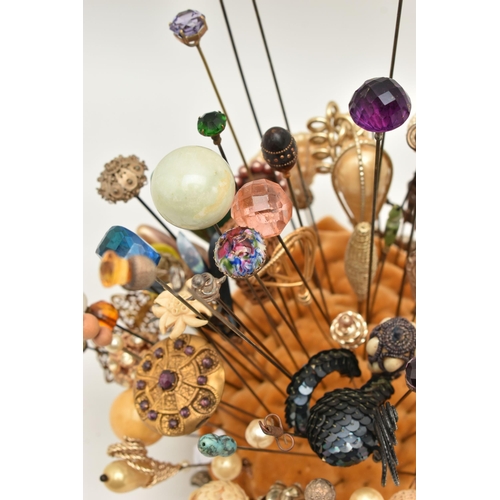 120 - A COLLECTION OF HAT PINS, approximately ninety six hat pins of varying designs, to include eight sil... 