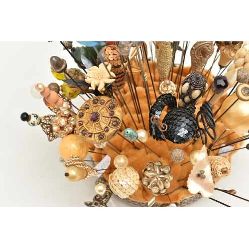 120 - A COLLECTION OF HAT PINS, approximately ninety six hat pins of varying designs, to include eight sil... 