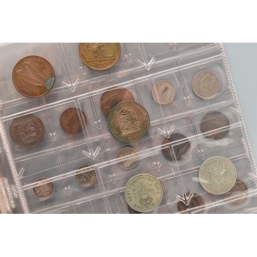 138 - A SMALL CARDBOARD BOX AND AN ALBUM OF WORLD COINS, some Silver content