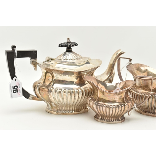 95 - A GEORGE V THREE PIECE SILVER TEA SET, to include a tea pot, a sugar pot and milk jug, detailed with... 