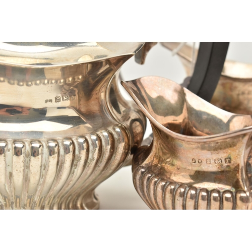 95 - A GEORGE V THREE PIECE SILVER TEA SET, to include a tea pot, a sugar pot and milk jug, detailed with... 