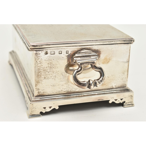 96 - A GEORGE V SILVER CIGAR BOX, rectangular form, raised on four bracket feet, two knopped handles to t... 