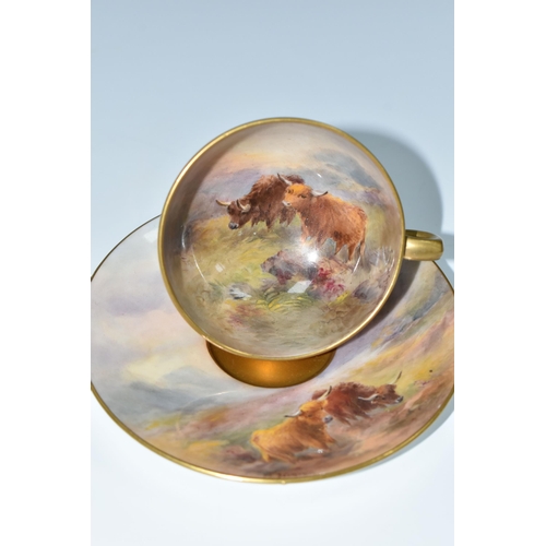 325 - A ROYAL WORCESTER TEACUP AND SAUCER BY HARRY STINTON, painted with Highland cattle in a Lochside set... 