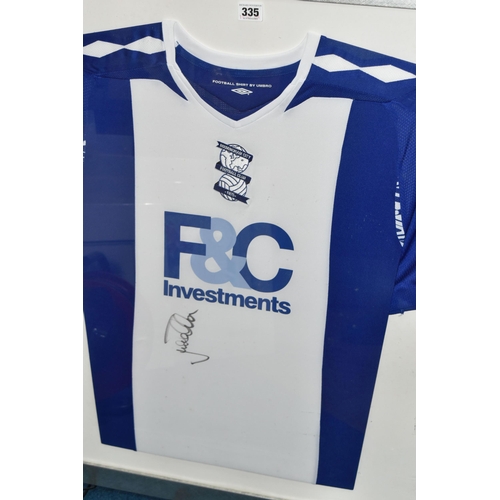 335 - TWO FRAMED AND GLAZED SIGNED BIRMINGHAM CITY HOME FOOTBALL SHIRTS, one signed by Lee Carsley, the ot... 