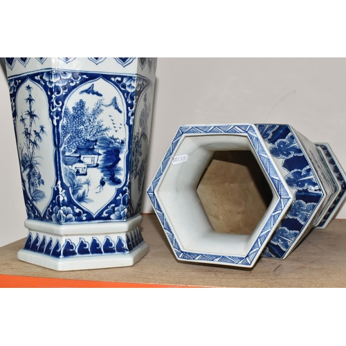 336 - TWO LARGE HEXAGONAL BLUE AND WHITE CHINESE VASES, decorated with pine trees, blossom and mountainsid... 