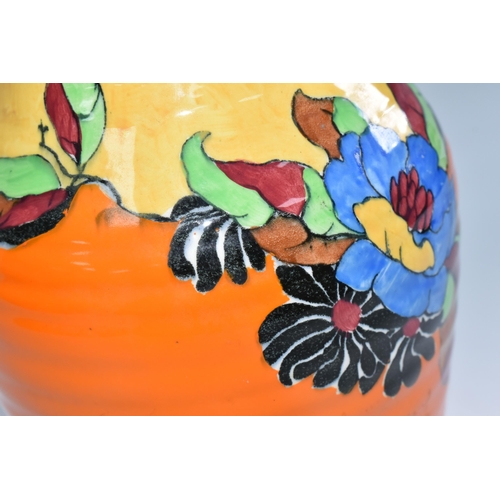 371 - A CLARICE CLIFF 'INDIAN SUMMER' PATTERN ISIS VASE, the baluster vase painted with flowers and leaves... 