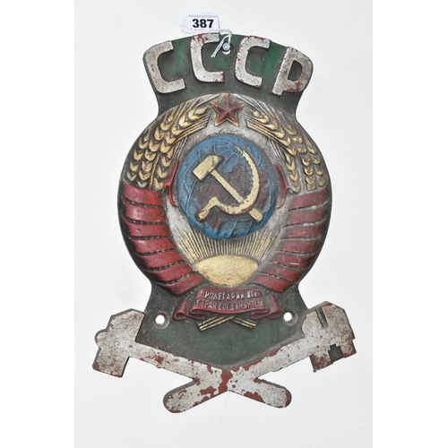 387 - A CAST IRON SOVIET TRAIN CARRIAGE INSIGNIA marked CCCP over a hammer and sickle super-imposed on a s... 