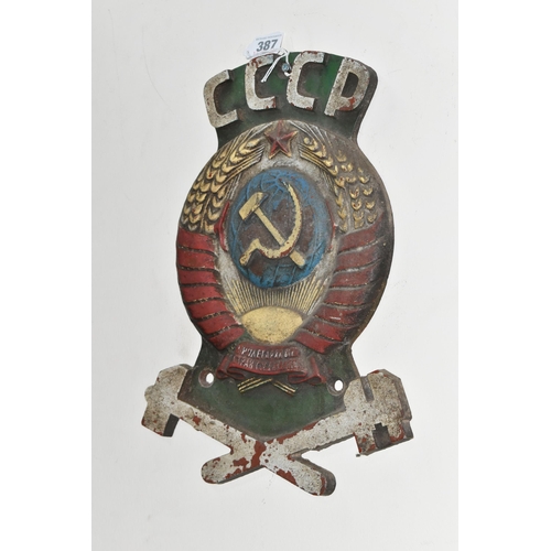 387 - A CAST IRON SOVIET TRAIN CARRIAGE INSIGNIA marked CCCP over a hammer and sickle super-imposed on a s... 