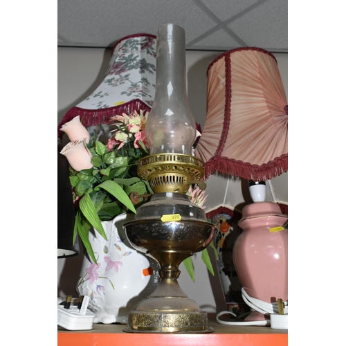 395 - A LARGE GROUP OF ORNAMENTAL LAMPS AND VASES comprising approximately thirteen lamps in assorted styl... 