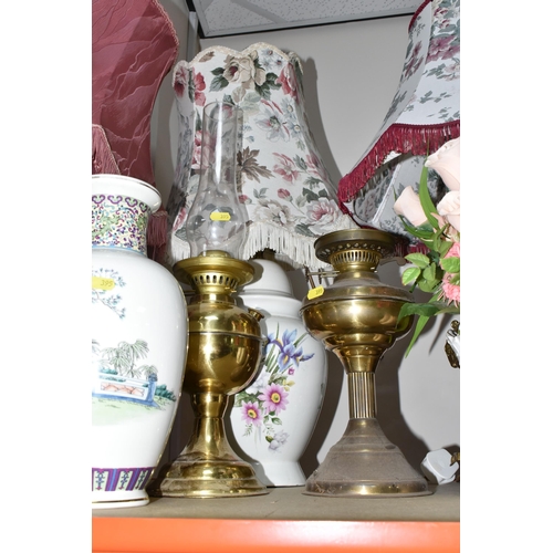 395 - A LARGE GROUP OF ORNAMENTAL LAMPS AND VASES comprising approximately thirteen lamps in assorted styl... 