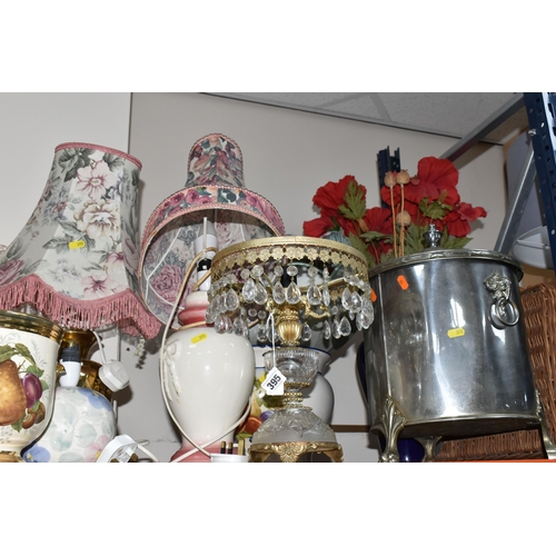 395 - A LARGE GROUP OF ORNAMENTAL LAMPS AND VASES comprising approximately thirteen lamps in assorted styl... 