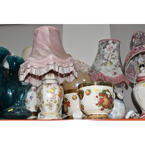 395 - A LARGE GROUP OF ORNAMENTAL LAMPS AND VASES comprising approximately thirteen lamps in assorted styl... 