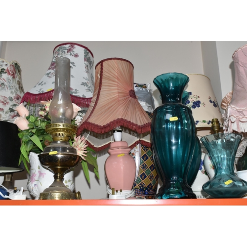 395 - A LARGE GROUP OF ORNAMENTAL LAMPS AND VASES comprising approximately thirteen lamps in assorted styl... 