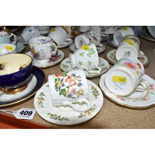 409 - A GROUP OF MOSTLY AYNSLEY COFFEE WARE to include various coffee cup and saucer sets to include Shang... 