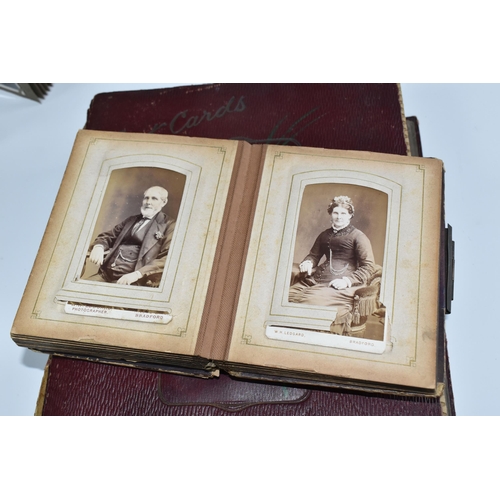 424 - Two Victorian/Edwardian Photograph Albums, both require restoration with a collection of portrait ph... 