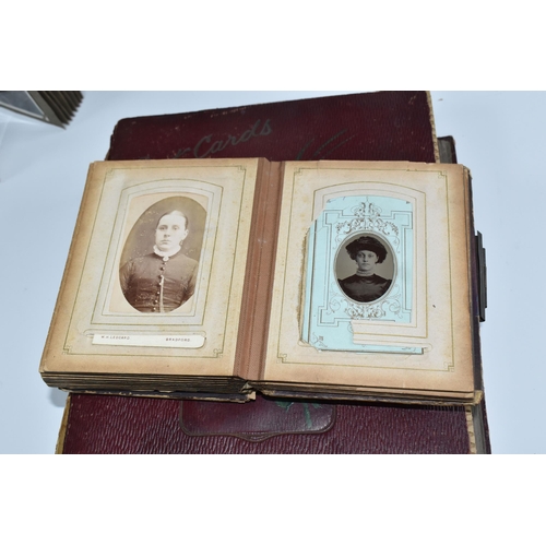 424 - Two Victorian/Edwardian Photograph Albums, both require restoration with a collection of portrait ph... 