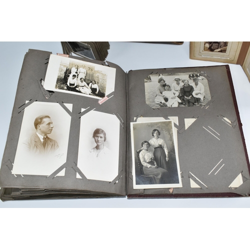 424 - Two Victorian/Edwardian Photograph Albums, both require restoration with a collection of portrait ph... 