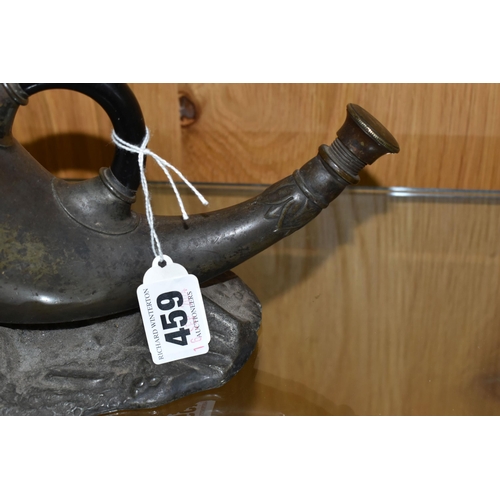 459 - A FIGURATIVE SPOON WARMER in the form of a horn with a stag rest on a landscaped base, length 27cm x... 