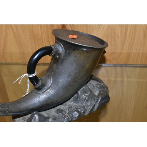 459 - A FIGURATIVE SPOON WARMER in the form of a horn with a stag rest on a landscaped base, length 27cm x... 