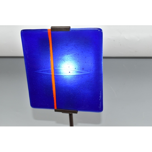 468 - A CLARISSE DUTRAIVE TABLE LAMP, with signed blue and red fused glass panel, on a metal stand, height... 