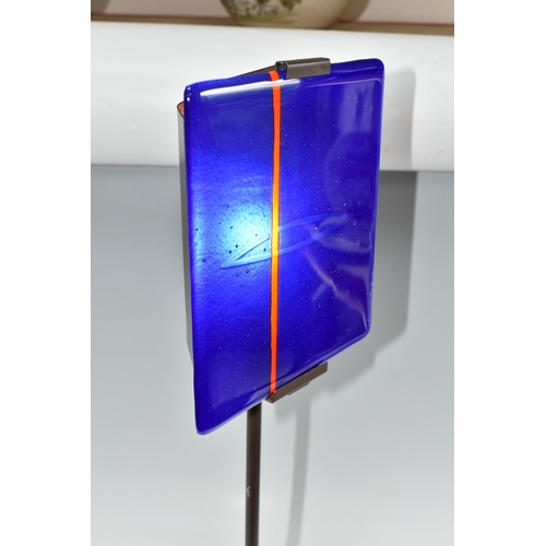 468 - A CLARISSE DUTRAIVE TABLE LAMP, with signed blue and red fused glass panel, on a metal stand, height... 