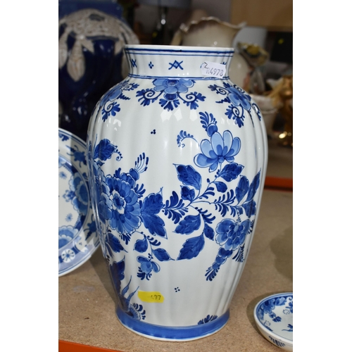 497 - A GROUP OF BLUE AND WHITE DELFT WARE CHARGERS AND VASE, comprising a floral design vase, height 26cm... 