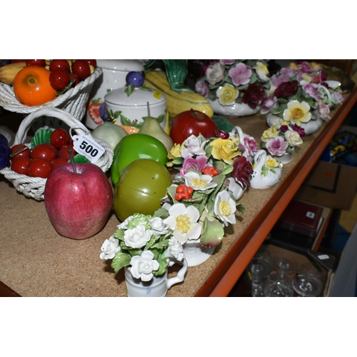 500 - A LARGE QUANTITY OF PORCELAIN FLOWERS AND FRUIT, together with three circular 'Barbola' mirrors, com... 