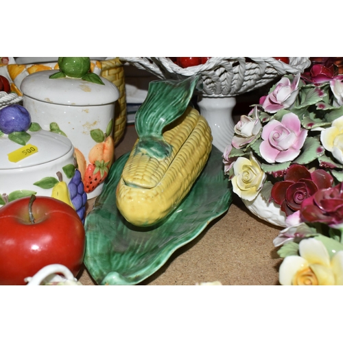 500 - A LARGE QUANTITY OF PORCELAIN FLOWERS AND FRUIT, together with three circular 'Barbola' mirrors, com... 