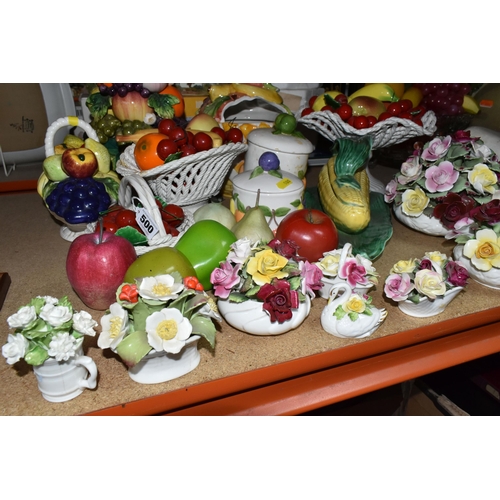 500 - A LARGE QUANTITY OF PORCELAIN FLOWERS AND FRUIT, together with three circular 'Barbola' mirrors, com... 