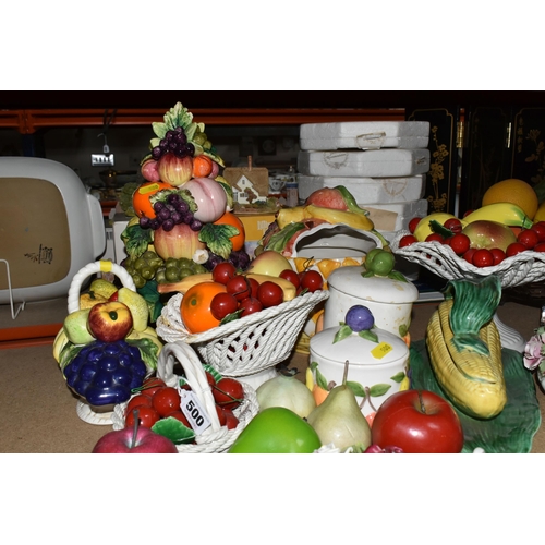 500 - A LARGE QUANTITY OF PORCELAIN FLOWERS AND FRUIT, together with three circular 'Barbola' mirrors, com... 