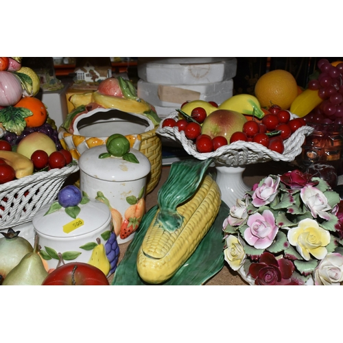 500 - A LARGE QUANTITY OF PORCELAIN FLOWERS AND FRUIT, together with three circular 'Barbola' mirrors, com... 