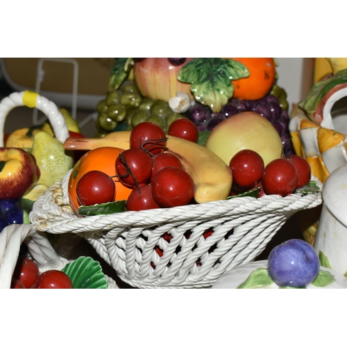 500 - A LARGE QUANTITY OF PORCELAIN FLOWERS AND FRUIT, together with three circular 'Barbola' mirrors, com... 