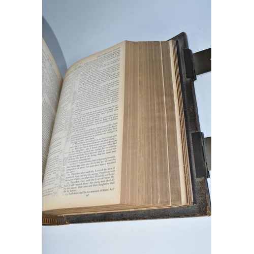 501 - TWO ANTIQUARIAN BIBLES comprising a large leather bound, brass clasped, gilt edged Holy Bible with C... 