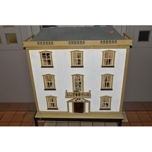 510 - A VINTAGE THREE-STOREY DOLLS HOUSE to include a nine room house with wooden dolls furniture, a magne... 