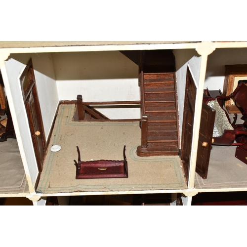 510 - A VINTAGE THREE-STOREY DOLLS HOUSE to include a nine room house with wooden dolls furniture, a magne... 