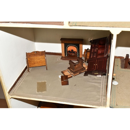 510 - A VINTAGE THREE-STOREY DOLLS HOUSE to include a nine room house with wooden dolls furniture, a magne... 