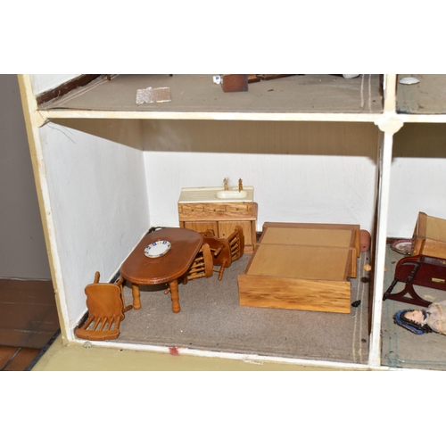 510 - A VINTAGE THREE-STOREY DOLLS HOUSE to include a nine room house with wooden dolls furniture, a magne... 