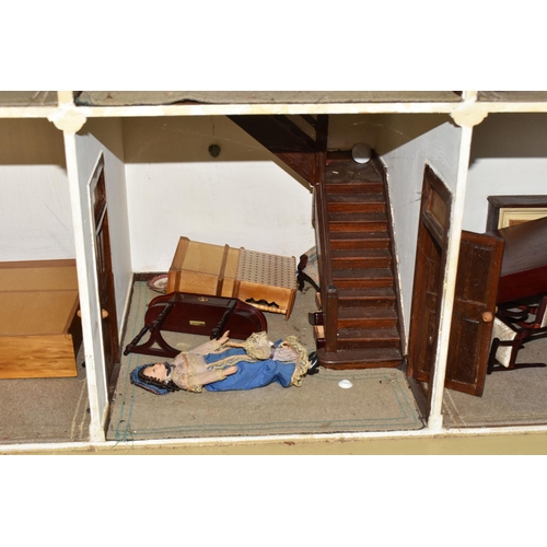 510 - A VINTAGE THREE-STOREY DOLLS HOUSE to include a nine room house with wooden dolls furniture, a magne... 