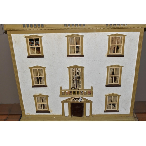 510 - A VINTAGE THREE-STOREY DOLLS HOUSE to include a nine room house with wooden dolls furniture, a magne... 