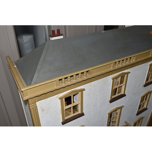 510 - A VINTAGE THREE-STOREY DOLLS HOUSE to include a nine room house with wooden dolls furniture, a magne... 