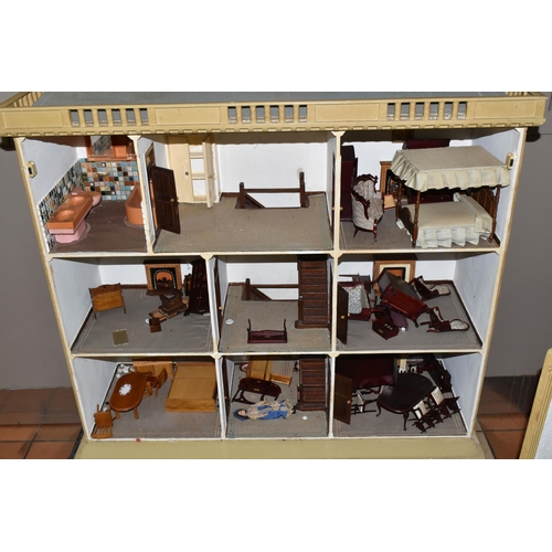 510 - A VINTAGE THREE-STOREY DOLLS HOUSE to include a nine room house with wooden dolls furniture, a magne... 